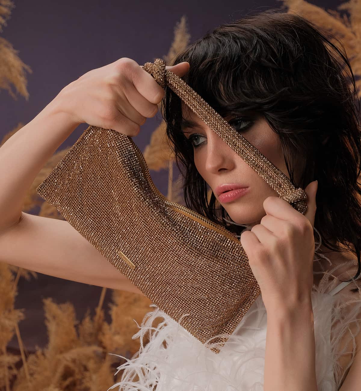 Woman showing Bag Cult Gaia 2023 La Galleria Yerevan. Clothing stores in Yerevan