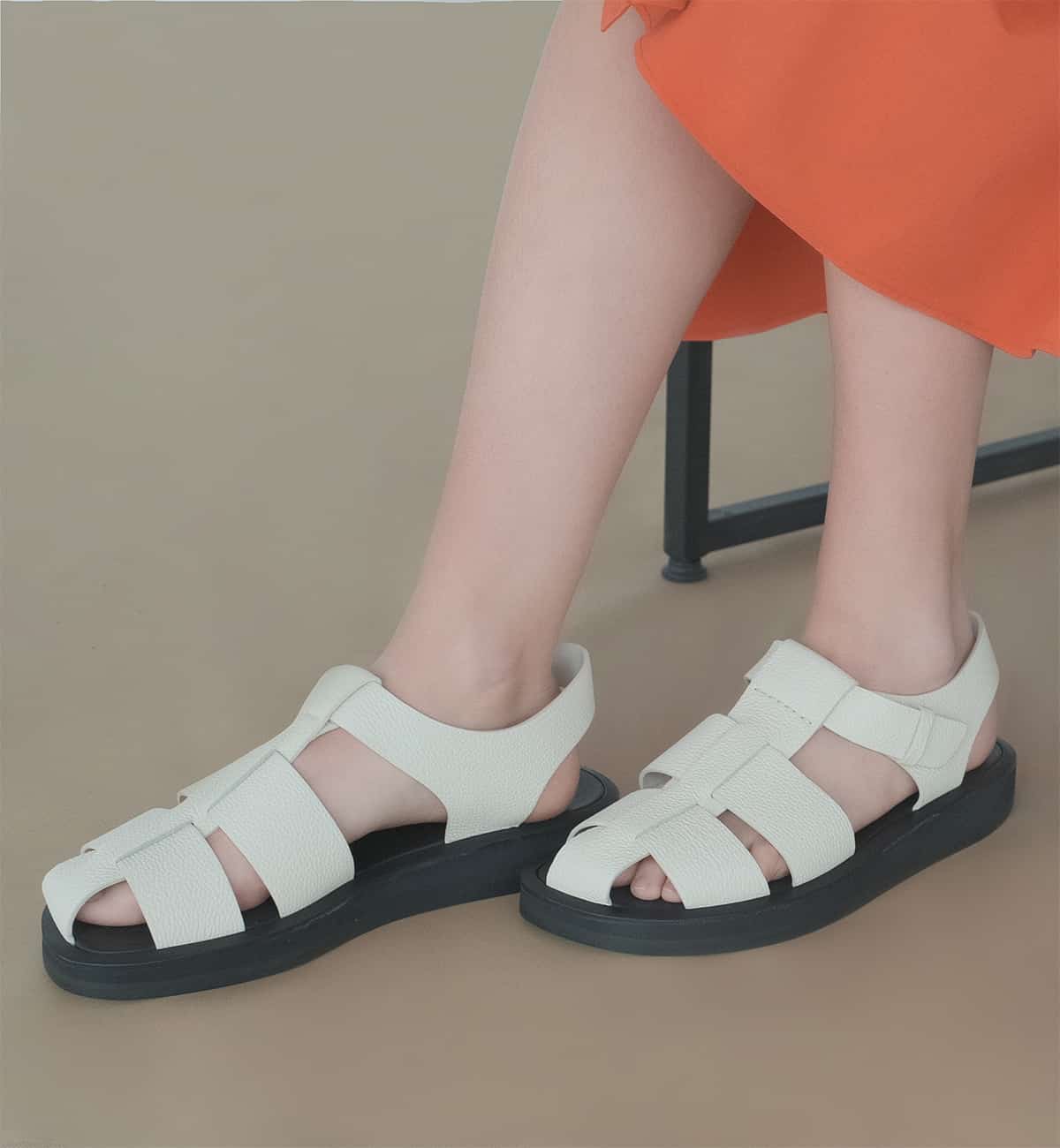 Woman wears The Row sandals from Spring-Summer 2022 collection
